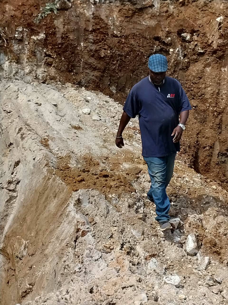 Inspecting excavation ridge
