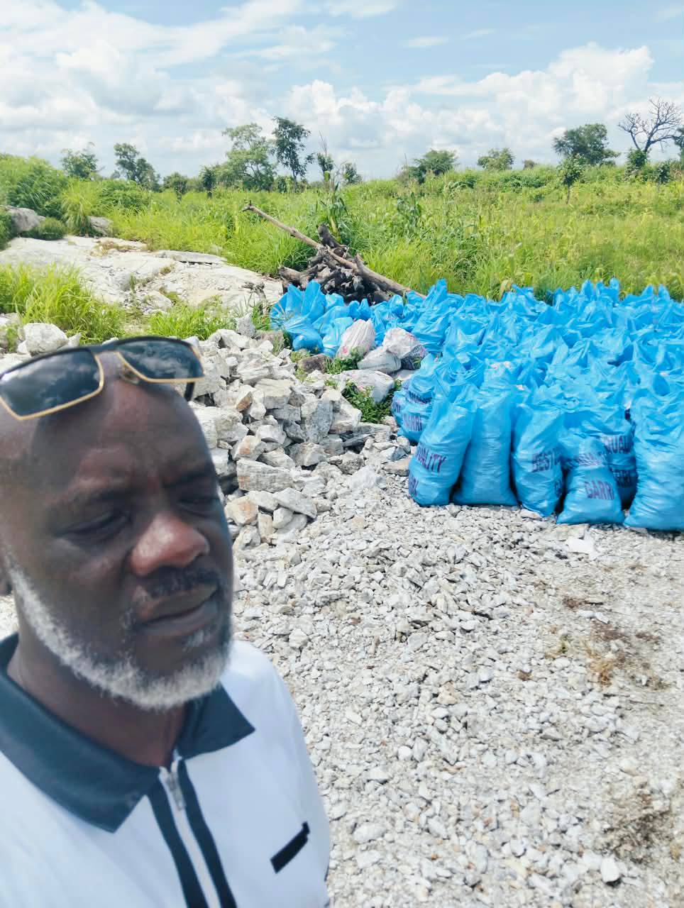 Bakobabs Managing Director & Founder Abdulsalam Bako Esq. inspecting stacked bags of mineral ore on site