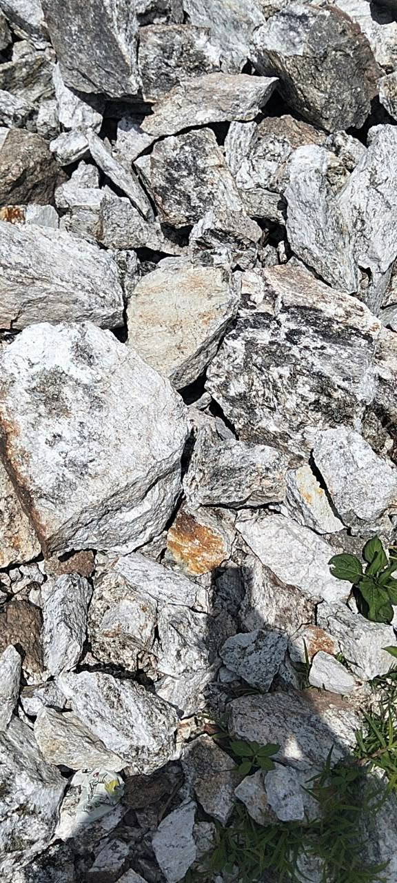 Spodumene lithium ore boulders on site